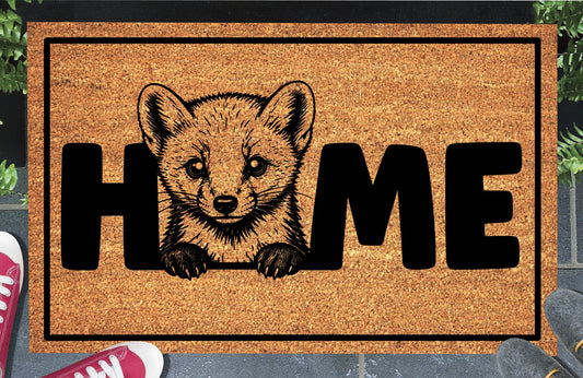 Pine Marten coir doormat lifestyle shot — Pine Marten illustration replaces the letter O in HOME, natural coir mat on a doorstep