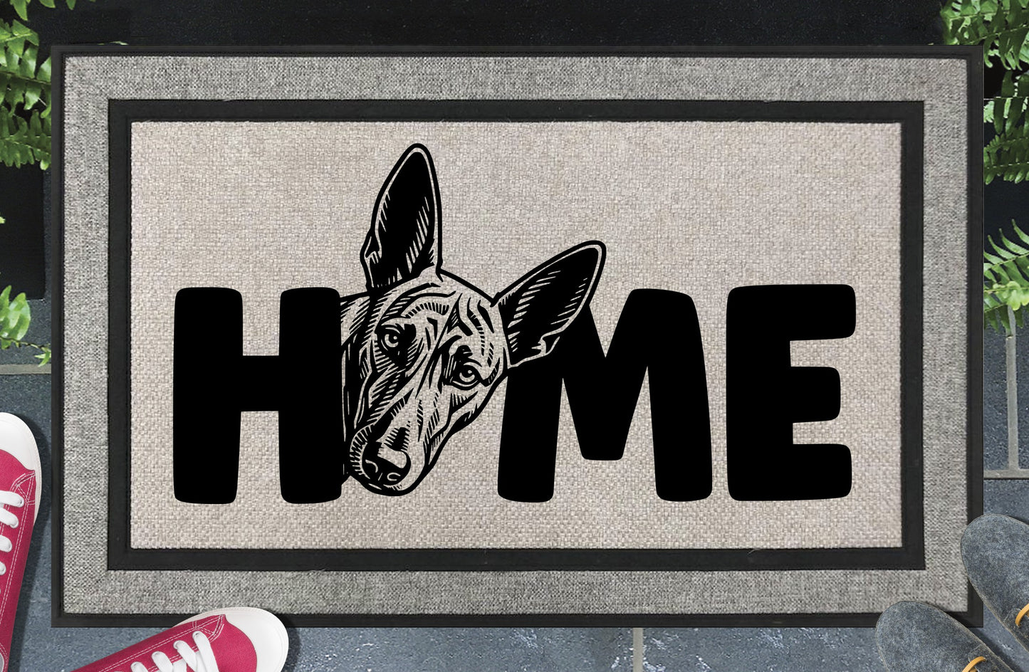 Podenco all-weather doormat #7 with Poddy illustration replacing the letter O in HOME — woven polyester welcome mat by Pupular Mats 
