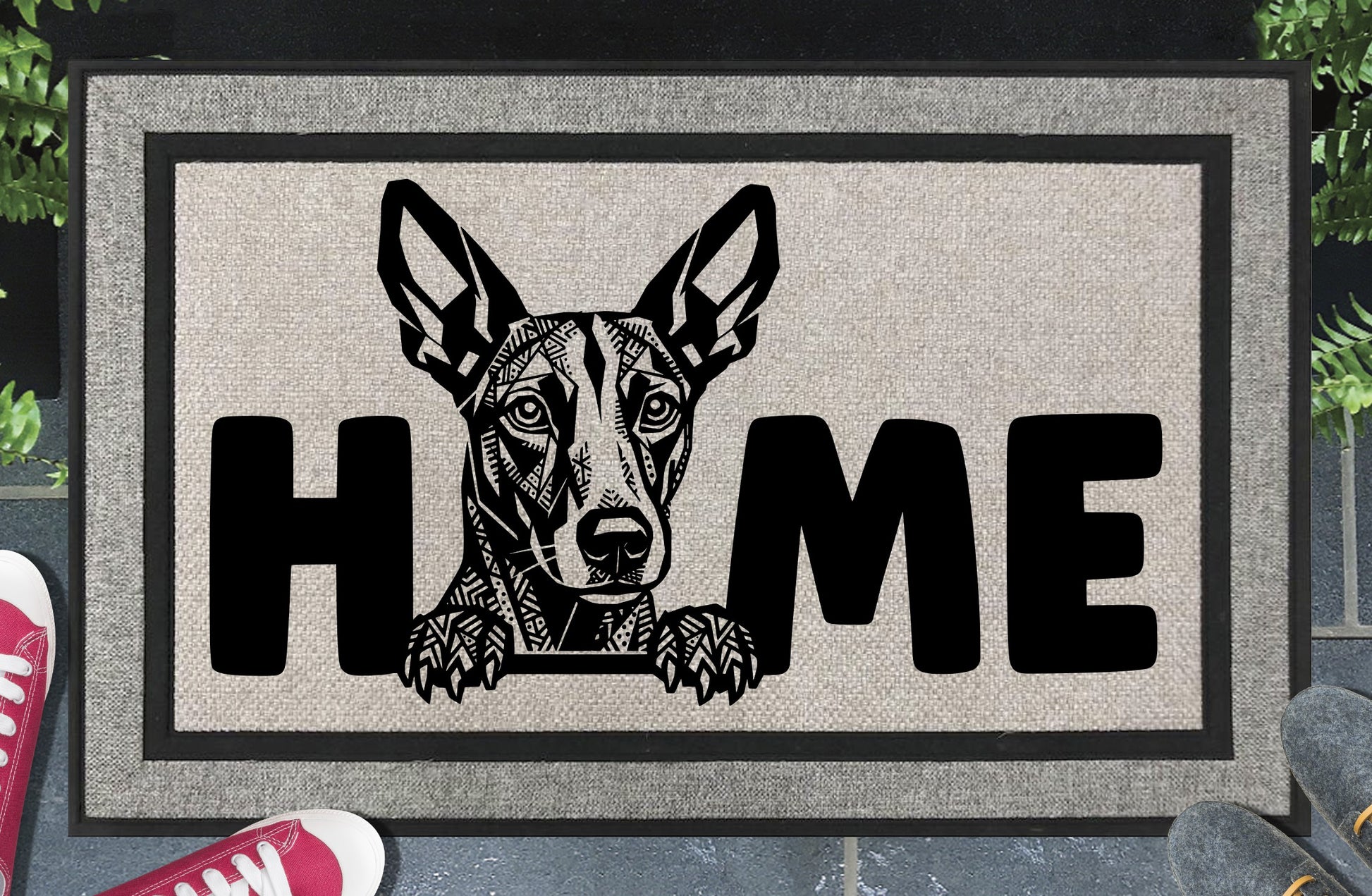Podenco all-weather doormat #8 with Mediterranean Hound illustration replacing the letter O in HOME — woven polyester welcome mat by Pupular Mats
