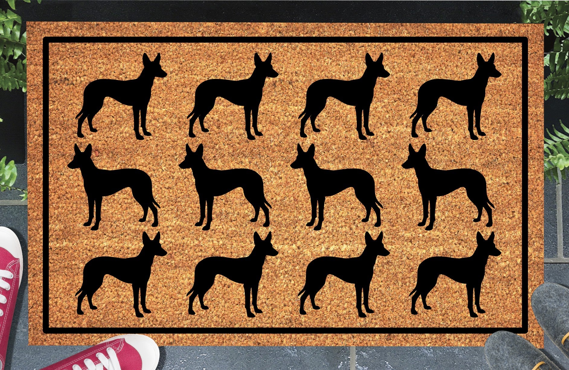 Podenco Parade coir doormat in a doorway setting — rows of Podenco silhouettes with large upright ears and lean athletic frame in a repeating pattern on a natural coir mat with black border