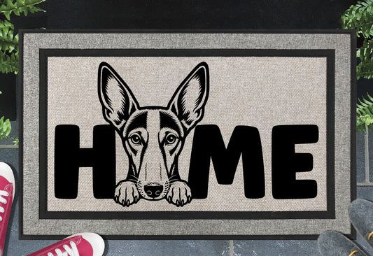 Podenco all-weather doormat #3 — Podenco illustration replaces the letter O in HOME, woven polyester linen-look finish, 18x30"