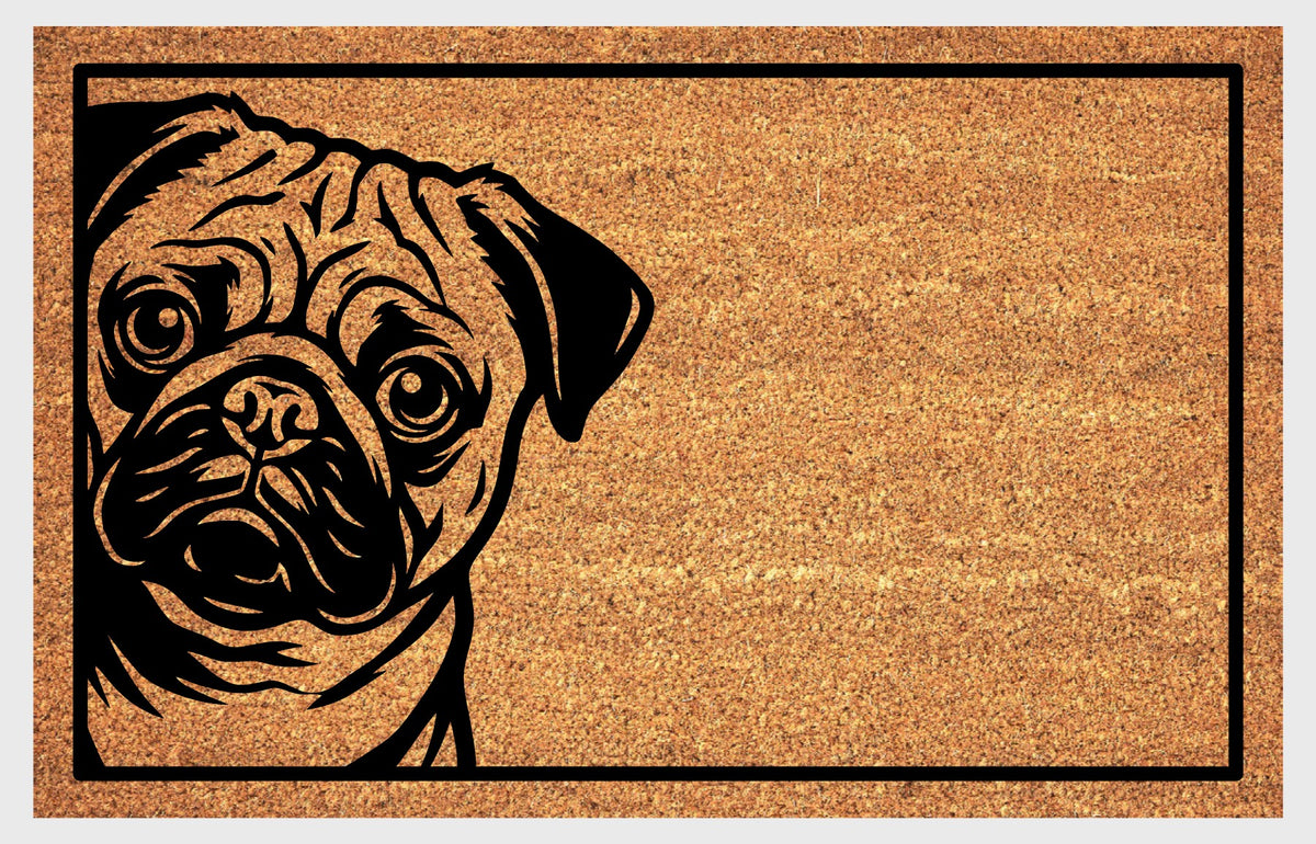 Close-up of a natural coir doormat featuring a wide-eyed Pug peeking from the left edge inside a black border.
