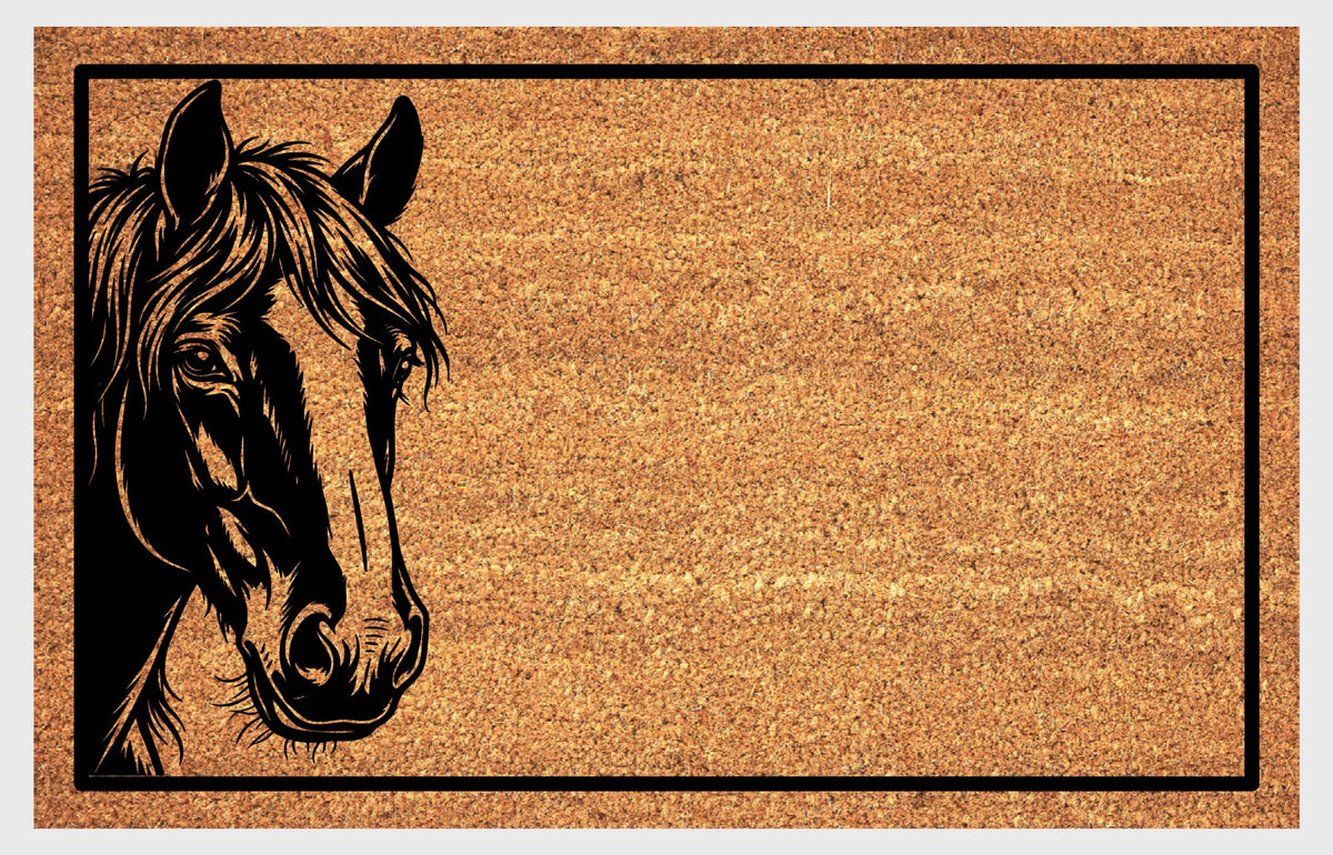 Natural coir doormat featuring a black Shire Horse portrait peeking from the left edge, with upright ears, a flowing forelock and rectangular border.