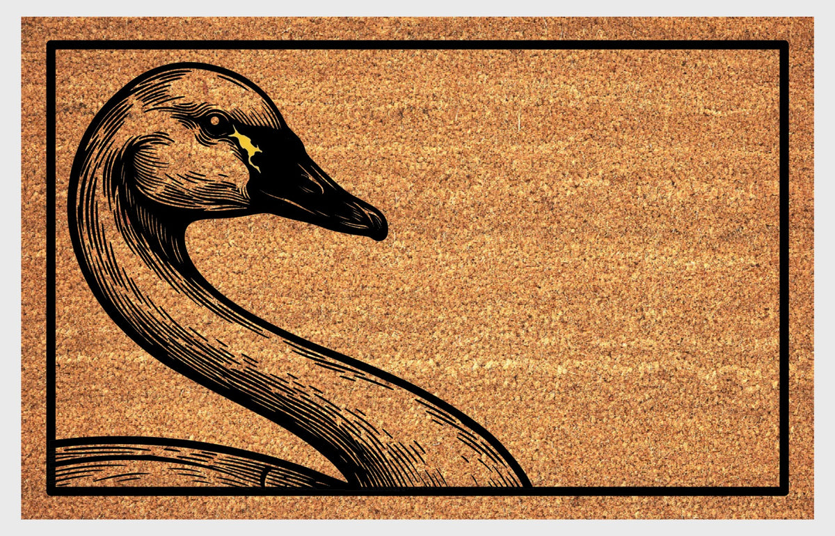 Natural coir doormat featuring a Tundra Swan peeking from the left edge, with a sweeping curved neck, finely lined feathers, mostly black bill and small yellow patch near the eye.