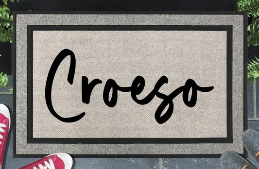 Croeso all-weather doormat #3 — Welsh welcome word in casual script lettering, woven polyester, linen-look finish, non-slip backing, 18x30"