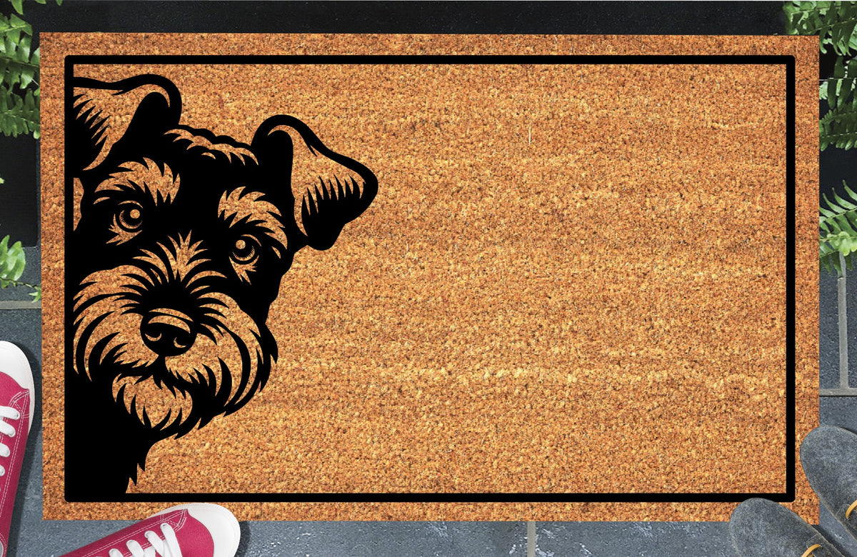 Welsh Terrier doormat with a bearded Welshie portrait at the left edge and black border, displayed on a paved doorstep.